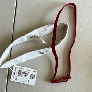 Lululemon headbands (2).  One is white and 1” wide, the other is red  1/3” wide